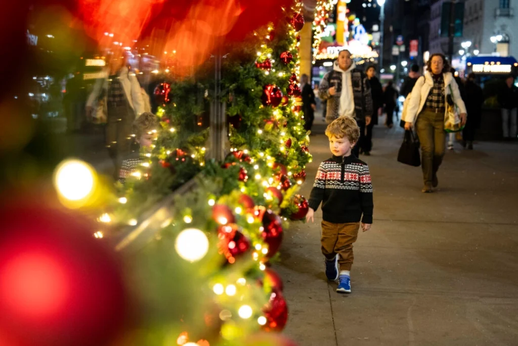 A boy looks at holiday decorations in New York City.